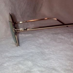 Gold Dior sunglasses.